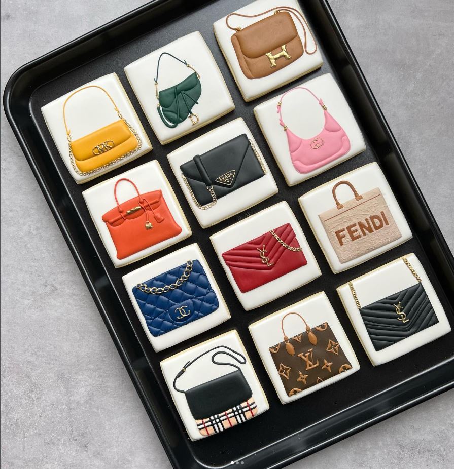 Custom sugar cookies designed as miniature designer handbags